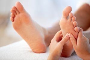 Relaxing reflexology treatment on the feet